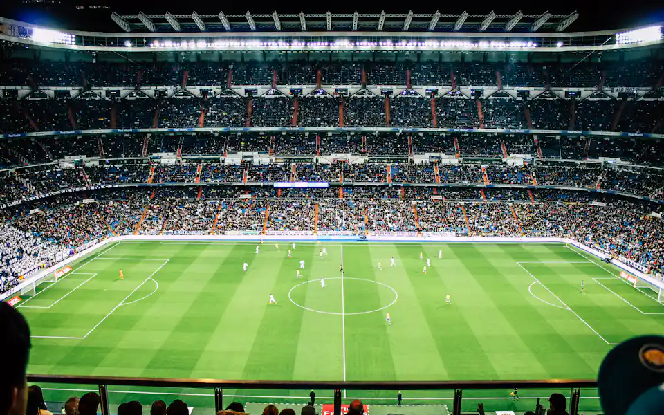 Fans filling a stadium for a big match, the kind of game BunnyGaming sports bettors follow